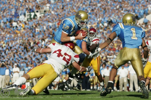 Dec 2, 2006; Pasadena, CA, USA; UCLA Bruins quarterback (12) Patrick Cowan scores a touchdown against the Southern California Trojans during the first half at the Rose Bowl.